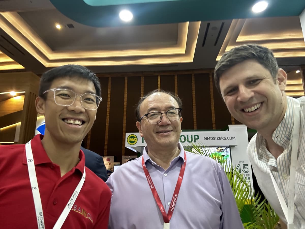 Alex with the Baniql founder and a partner at the Shanghai Metals Market conference in Jakarta
